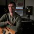 a man with a guitar on a background of music equipment JAS AV d 70x70 - Fresh Vlog Hip-Hop