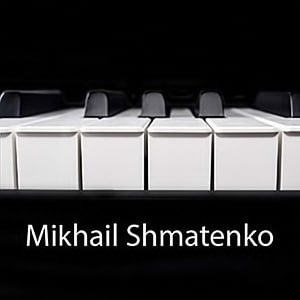 Piano keys in black and white with inscription Makhail Shmatenko