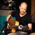 a guitarist playing an acoustic guitar Bernd Voss AV IM 70x70 - Can´t Complain